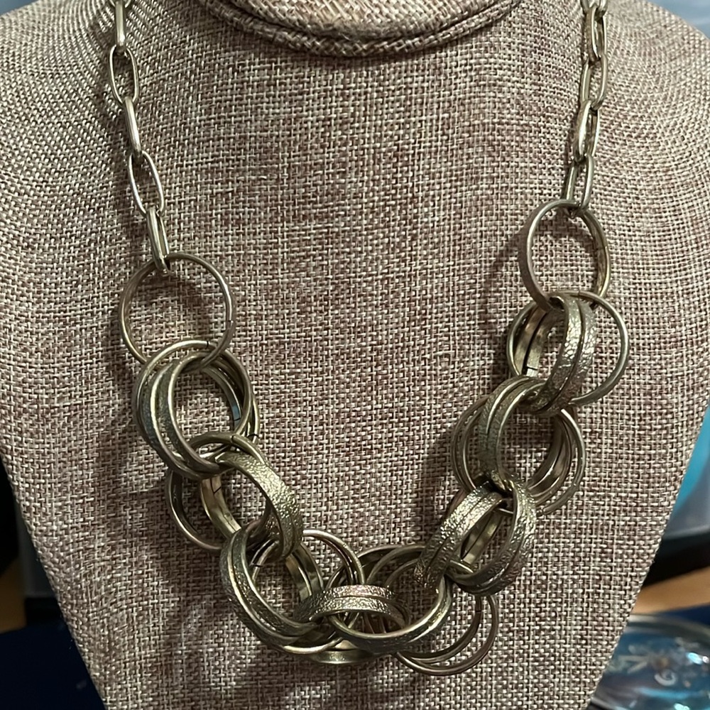 Necklace with multiple rings, Silvertone with hints of gold